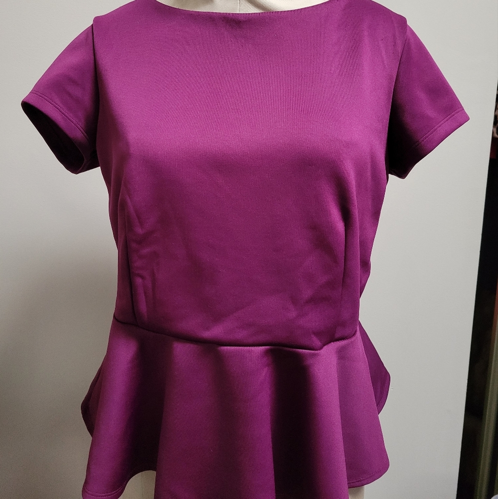 Peplum Bisou Bisou top in Purple.